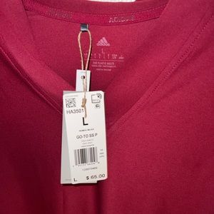 Adidas Womens golf shirt v neck, size Large, NWT $65 price tag.